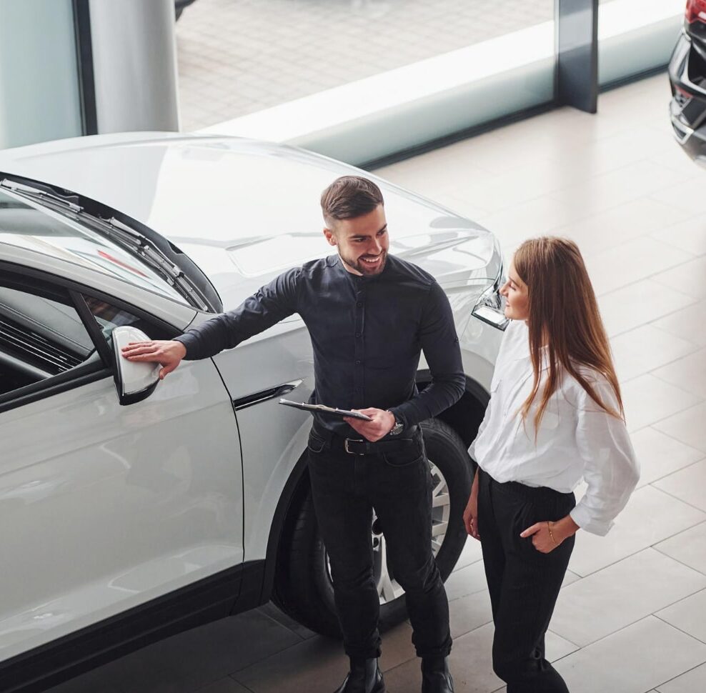 car dealership assistant with client